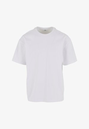 Balts īsās piedurknes T-krekls, izgatavots no mīksta kokvilnas, ar apaļu kakla izgriezumu un brīvu piegriezumu ar taisnu apakšmalu. Nav redzami raksti vai akcenti.