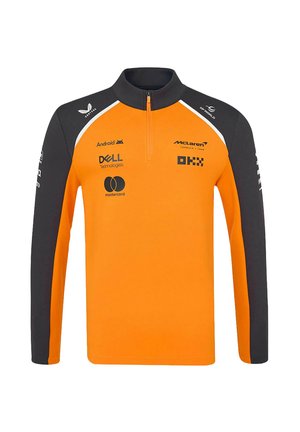 Polopulower z półzamkiem w jasnopomarańczowym kolorze z jasnoszarymi rękawami. Posiada logo, w tym McLaren i Dell, o gładkiej teksturze i sportowym kroju.
