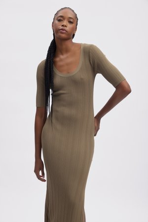 Khaki ribbed dress with short sleeves, a scoop neckline, and a fitted silhouette. Features texture and a side slit for added detail.