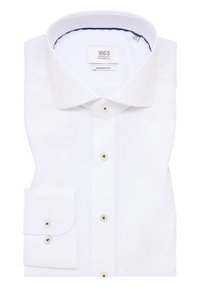 Witte dress-shirt met een gestructureerde stof, moderne pasvorm en een semi-spread kraag. Voorzien van knoopsluiting en een enkele zak op de mouw.