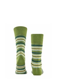 Grüne Socken mit horizontalen Streifen in Gelb, Weiß und Dunkelgrün. Gerippter Bund. Bequemer Strickstoff mit weicher Textur.
