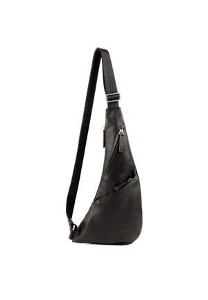 Black leather sling bag with a curved design, featuring two zippered compartments and an adjustable strap with embossed branding.