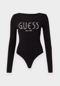 Body a maniche lunghe nero con scollatura a barca, decorato con "GUESS" in pietre brillanti e "EST.1981" in bianco, realizzato in tessuto elasticizzato.