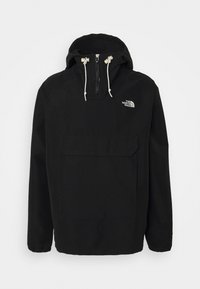 Veste noire à enfiler avec capuche, fermeture éclair sur le devant, cordons blancs, grande poche avant et logo blanc The North Face sur la poitrine.