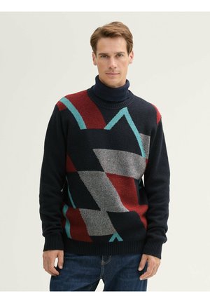 Gebreide coltrui in marineblauw, voorzien van geometrische patronen in rood, grijs en aquagroen, met ribbels aan de onderkant en mouwen voor een textuur-afwerking.