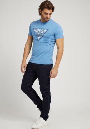 T-shirt con stampa - blau