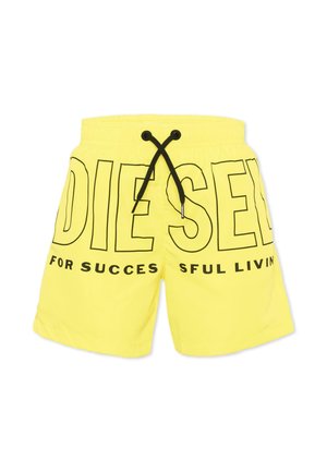 Short jaune avec cordon noir et grand texte noir contouré indiquant "DIESEL" ainsi qu'un texte plus petit "FOR SUCCESSFUL LIVING" à l'avant.