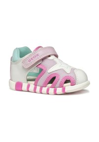 Sneakers per bambini bianchi e rosa con tomaia in rete, dettaglio a stella e cinturino regolabile. Presentano una suola bianca flessibile con accenti rosa.