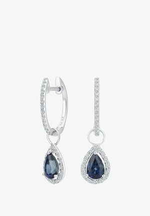 Hopeiset korvakorut, joissa pisaranmuotoiset siniset kivet ja ympärillä kirkkaat jalokivet. Design on huggie-tyylinen rengas, jossa on yksityiskohtainen koristelu.