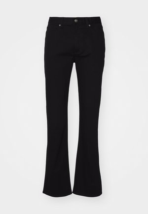 Sorte højtaljede flared jeans med frontknap og fem-lomme-design, præsenteret på en hvid baggrund.