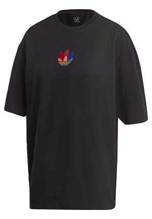 T-shirt noir oversize à manches courtes avec un petit logo trèfle Adidas multicolore centré sur la poitrine.