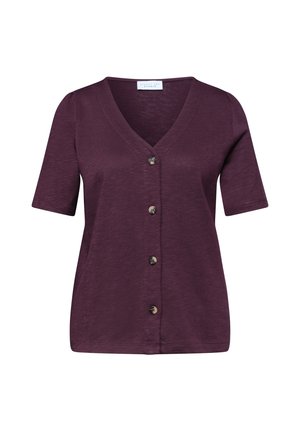 Camicia a maniche corte con scollo a V color prugna viola con cinque bottoni marroni e tessuto strutturato.