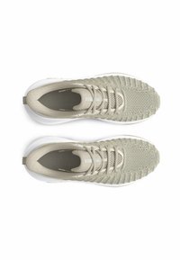 Beige athletic shoes with a textured mesh upper, rounded toe, and white rubber sole. Features laces and a subtle brand logo on the insole.