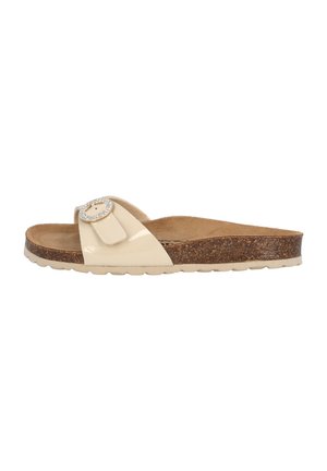 Beige patent slide sandal with a cork sole, decorated with a round metal buckle. Features a flat design and soft inner lining.