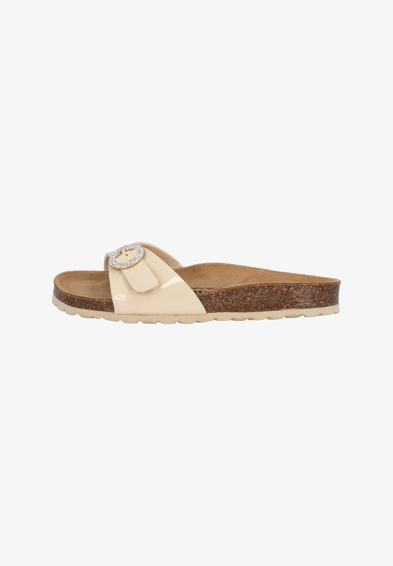 Beige gepatineerde slide sandaal met een kurken zool, versierd met een ronde metalen gesp. Heeft een plat ontwerp en een zachte binnenvoering.