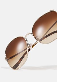 COACH Päikeseprillid - shiny light gold-coloured