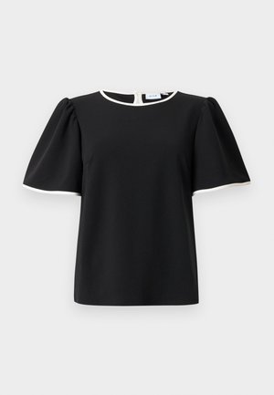 Schwarze Bluse mit kurzen Puffärmeln und weißem Saum am Halsausschnitt und den Ärmelsäumen, mit einer Knopfschließe auf der Rückseite.