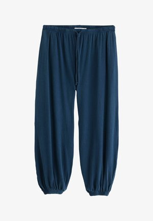 Pantaloni de trening bleumarin largi, cu talie elastică, șnur reglabil și manșete elastice la glezne, afișați așezați.