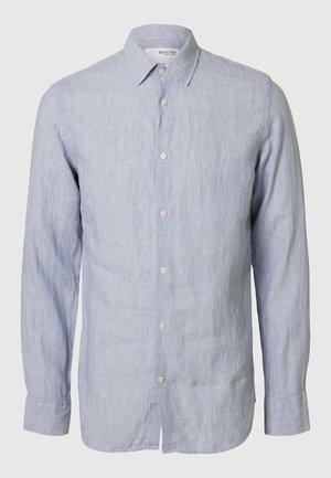 Chemise à manches longues bleu clair à boutons, en lin, avec un col classique, un ourlet arrondi et cinq boutons à l'avant.