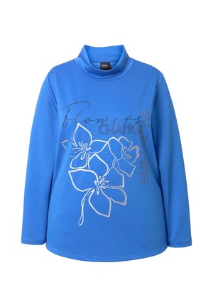 Blauw top met lange mouwen en col, met zilveren bloemenontwerp en tekst "Flowers Change Everything", gemaakt van zachte stof met een gladde textuur.