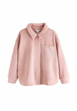 Pink corduroy jacket with a collar, zip closure, and a chest pocket. Features a soft texture and relaxed fit with rounded hem.