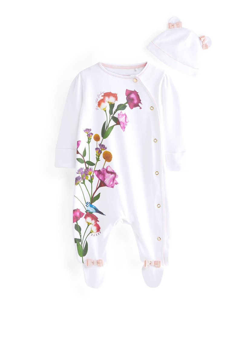 Tutina bianca con stampa floreale colorata, bottoni a pressione dorati e rifiniture rosate. Include un cappellino abbinato con orecchie e fiocco.