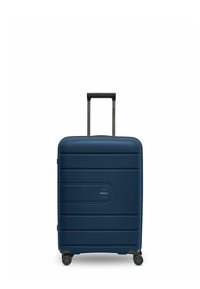 Valigia rigida blu navy con quattro ruote, manico nero estraibile e logo circolare sul pannello anteriore.