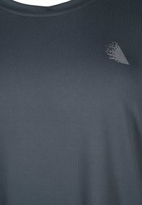 Short-sleeve, dark gray athletic shirt with a crew neckline and a textured, subtle pattern. Features a small logo accent on the chest.