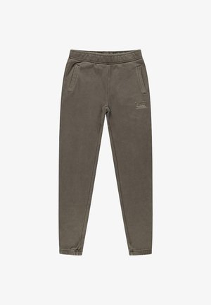 Grijze katoenen joggers met zijzakken, elastyche tailleband, bijgesneden enkels en bedrukte tekst aan de voorkant. Zachte, gladde textuur.