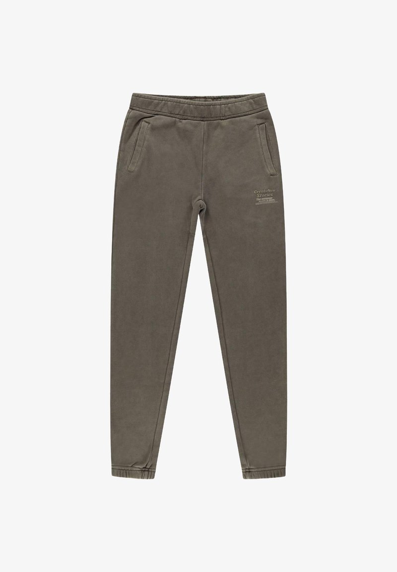 Grijze katoenen joggers met zijzakken, elastyche tailleband, bijgesneden enkels en bedrukte tekst aan de voorkant. Zachte, gladde textuur.