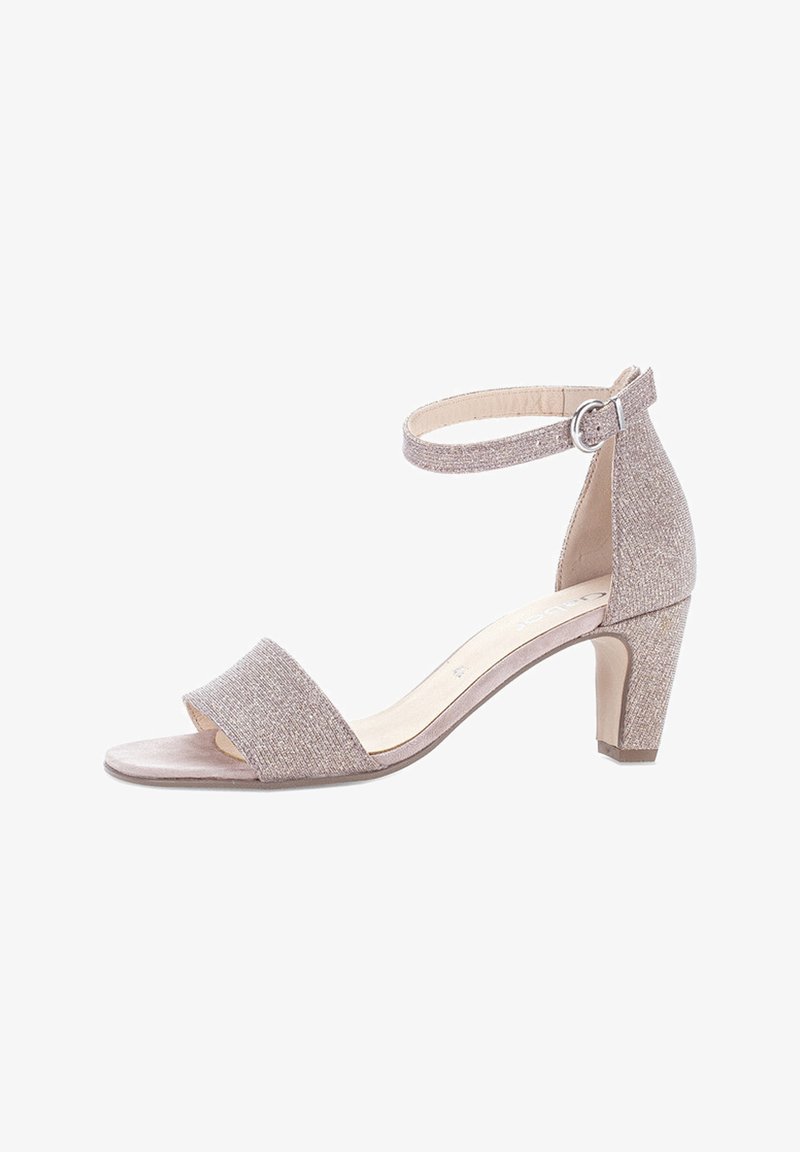 Beige heeled sandal with textured fabric, open toe, ankle strap, and a modest block heel. Smooth insole, minimalistic design.