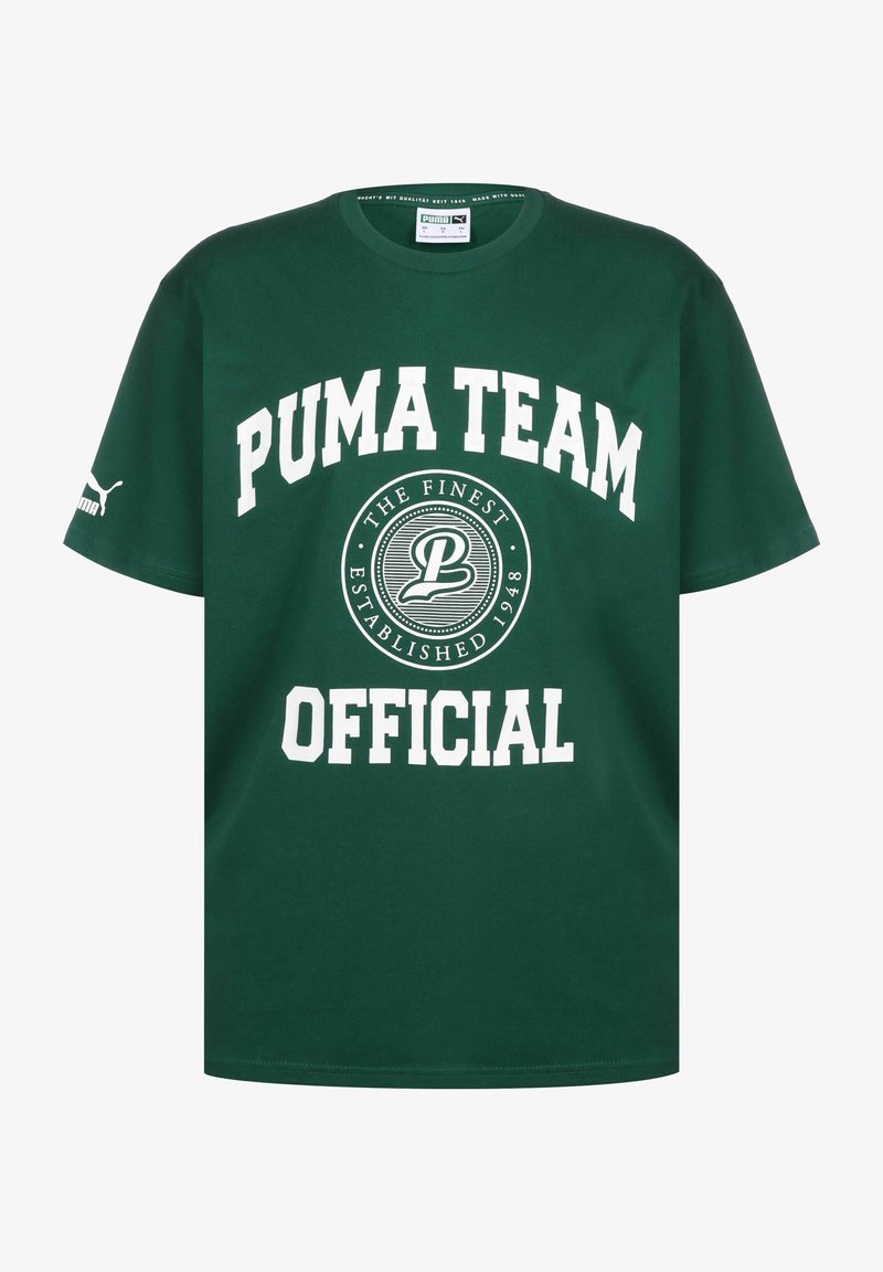 Žalia medvilninė marškinėliai su trumpomis rankovėmis, su balta užrašu "PUMA TEAM OFFICIAL" ir apvaliu logotipo dizainu centre.