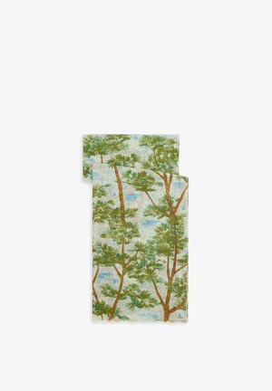 Fabric featuring a patterned design with green trees on a blue and cream background. Edges are slightly frayed, with a brand name visible.