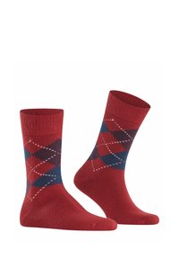 Calze rosse con un motivo argyle in blu e rosso scuro, con contorni a diamante bianchi. Realizzate in un materiale morbido e texturizzato.