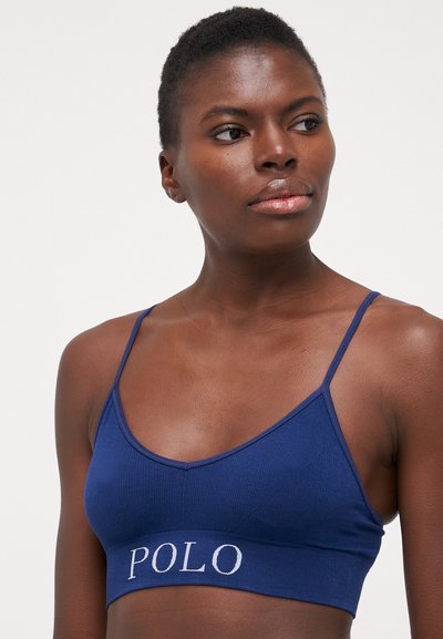 Navy zila ribota bralette ar regulējamiem siksniņām un baltu izšūtu "POLO" logotipu uz elastīgās joslas. Vienkārša, pieguļoša forma.
