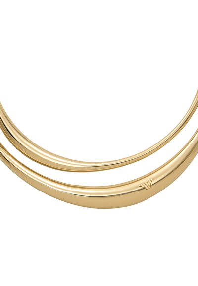 Gold-tone double bangle bracelet with a smooth, shiny finish; features a subtle brand logo engraved on the inner side.