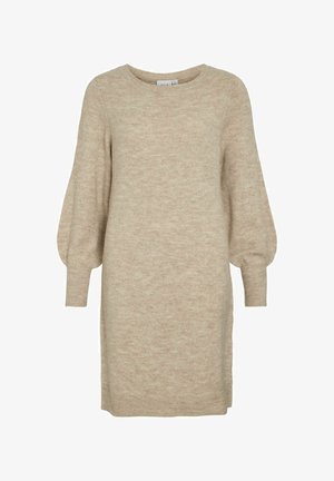 Šviesiai ruda megzta suknelė su apvalia iškirpte ir pūstomis ilgomis rankovėmis. Pasižymi minkšta tekstūra ir šoniniu įplyšimu, kad būtų lengviau judėti.