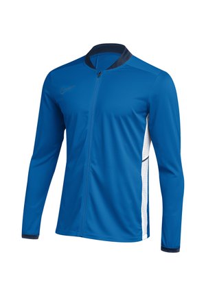 Blaues Sportjacke mit durchgehendem Reißverschluss, langen Ärmeln, weißen Seitenpaneelen, schwarzem Kragen und Bündchen sowie einem kleinen Nike-Logo auf der Brust.