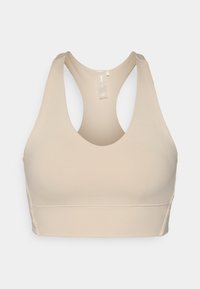 Beige treningsBH med rund halsringning, racerback-design, glatt tekstur, og en bred kant i bunnen for støtte.