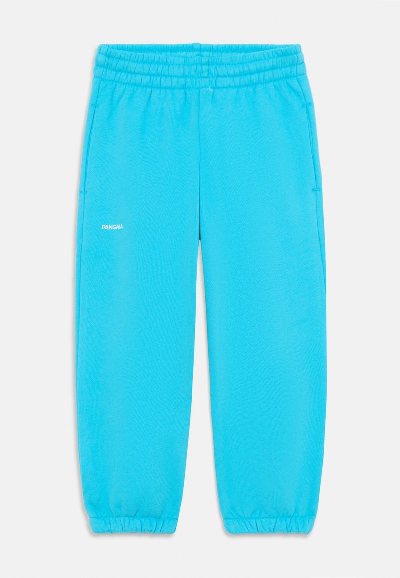 Pantalones de chándal turquesa con cintura elástica, puños ajustados, bolsillos laterales y un pequeño logo blanco en el muslo izquierdo. Textura suave.