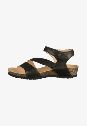 Black leather sandal with cross straps and adjustable ankle strap. Cork-like wedge sole for support, smooth inner lining, and textured outsole.
