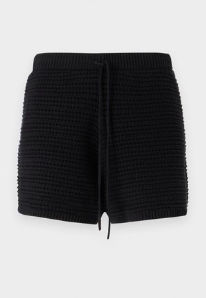 Sorte strikkede shorts med et teksturert mønster, elastisk midjebånd med snøring, og ribbede detaljer ved kanten og i midjen.