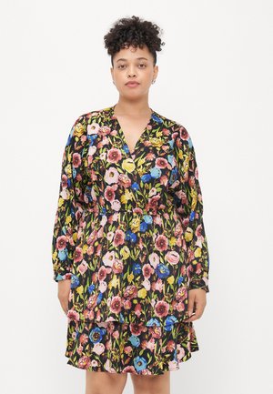 Floral dress with long sleeves, featuring a black background and multicolored flowers. Includes a V-neck and a gathered waist detail.