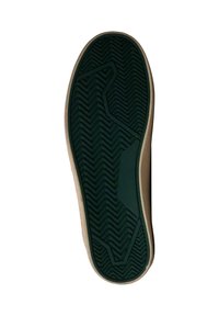 Suela de zapato de goma verde con un patrón de zigzag, acentos laterales en beige y una superficie texturizada para agarre y tracción.