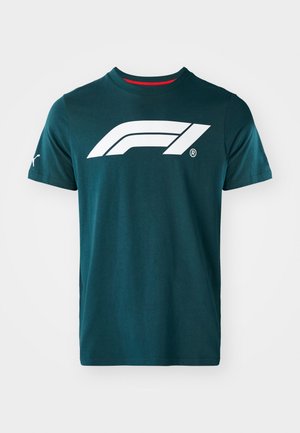 Teal bomulds t-shirt med et stort hvidt Formula 1-logo på forsiden, korte ærmer og en rød kant ved kraven.