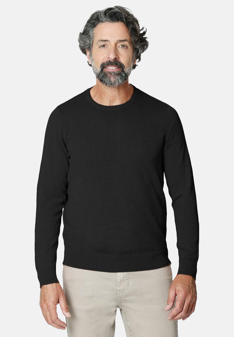 Jersey de lana negra con mangas largas y escote redondo. Presenta puños y dobladillo acanalados. Textura suave, diseño minimalista.