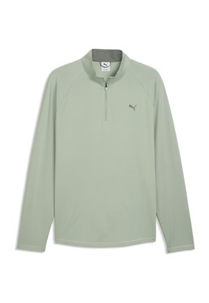 Lysegrøn sportsbluse med lange ærmer, kvart lynlås og Puma-logo på venstre bryst.