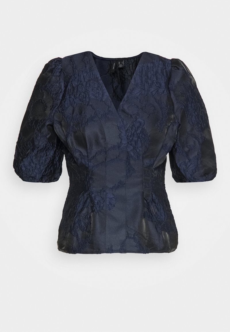 Navy blue blouse with puffed short sleeves, V-neck, textured floral pattern, and structured silhouette, featuring contrasting fabric sections.