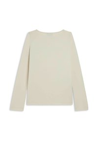 Maglietta a maniche lunghe di un beige chiaro, realizzata in tessuto liscio. Presenta un collo rotondo e spacchi laterali all'orlo per una vestibilità rilassata.