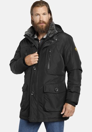 Black insulated jacket with a fur-lined hood, zippered chest pocket, button closures, and two front patch pockets. Soft texture, durable design.